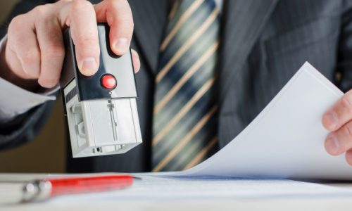 lawyer-notary-puts-seal-document-stamp-man-s-hand_76255-440